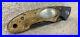 Browning-Model-77-Folding-Knife-Mammoth-Tooth-Look-Handle-Damascus-Steel-Blade-01-ny