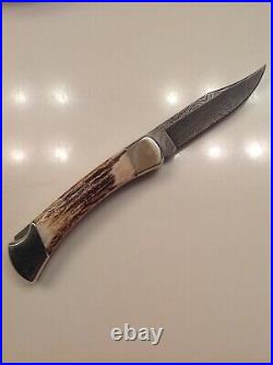 Buck 110 Folding Hunter Knife with Stag Handle and Damascus Blade Box Sheath NOS