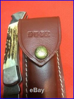 Buck 110 Folding Knife, Stag handles, Damascus blade, circa 1989, new case