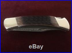 Buck 110 damascus blade folding knife jigged bone Never used or carried