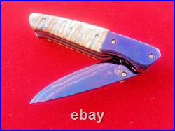 CUSTOM FOLDING KNIFE Blued Damascus STEEL Handmade Crafts Fossil Titanium RARE