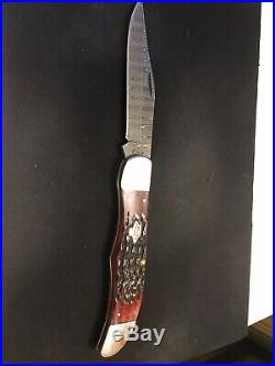 Case Knife. Large Folding Hunter. Crimson Bone Peach Seed Jig. Ladder Damascus