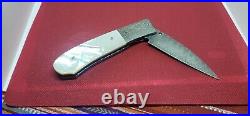 Centofante custom folding knife with pearl handle and damascus blade