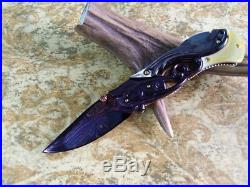 Custom Folding Knife by Suchat Jangtanong Damascus Steel Black White pearl carve