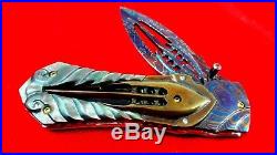 Custom Folding Knife by Suchat mosaic Damascus Steel black pearl carve Brass