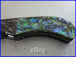 Custom folding pocket knife damascus blade and bolsters and abalone shell handle