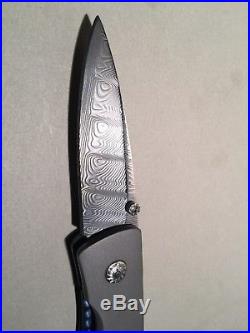 Custom handmade damascus folding knife