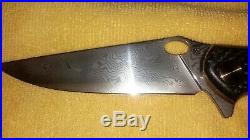 Custom handmade damascus steel folding knife