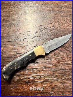 Damascus folding knife with pouch sharpener