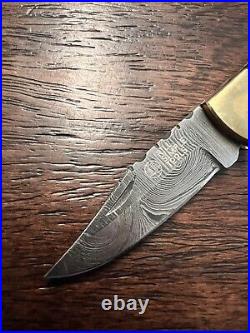 Damascus folding knife with pouch sharpener