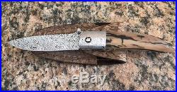 George Muller folding knife, s/s damascus blade & bolsters Fossil Hand withsheath