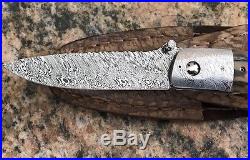 George Muller folding knife, s/s damascus blade & bolsters Fossil Hand withsheath