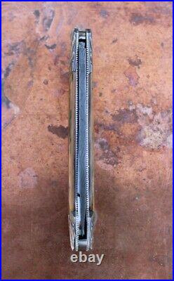 Ken Steigerwalt Handmade Lock Back Folding Knife. Sculpted Damascus Bolsters