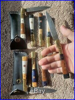 Lot of 10 handmade Damascus steel folding pocket knives. With sheaths