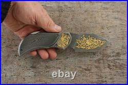 Premium Custom Author's folding Damascus knife decorated with gold Taiga
