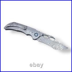 TRK 03 Folding Knife RWL34+PMC27 Damascus Blade & Handle with Titanium MultiDeploy TRK 03 Folding Knife RWL34+PMC27 Damascus Blade & Handle with Titanium MultiDeploy