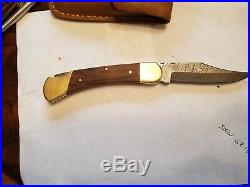 Vintage Buck 110 folding knife 3 pin Damascus 3 pin frames were first Buck110s