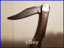 Vintage Buck 110 folding knife 3 pin Damascus 3 pin frames were first Buck110s