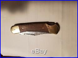 Vintage Buck 110 folding knife 3 pin Damascus 3 pin frames were first Buck110s