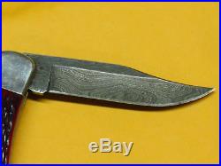 Vintage Buck 110V Damascus Red Bone Folding Knife with Sheath