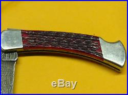 Vintage Buck 110V Damascus Red Bone Folding Knife with Sheath